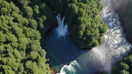 Aufkleber - Discover the breathtaking waterfall cascading through thick green forests in a serene natural environment