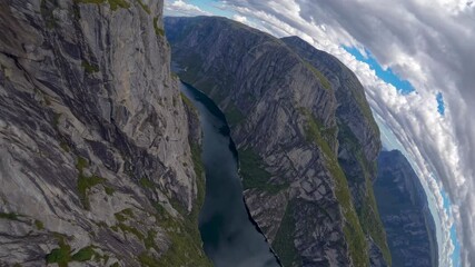 Aufkleber - Breathtaking aerial view of a deep canyon surrounded by steep cliffs and a serene river in Norway