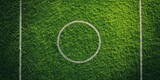 Green Field of Dreams: An aerial view of a pristine soccer field, its lush, vibrant green grass meticulously marked with white lines and circles, inviting both competition and camaraderie.