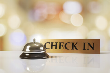 Poster - Hotel reception bell and check-in sign on glossy surface with glowing abstract light background in warm tones. 3D Rendering. 3D Rendering