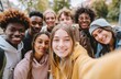 © Viral - Diverse group of teens smiling together selfie