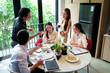 © snowing12 - Asian Business Team Meeting Collaboration Enjoying Food and Drinks at Table in Modern Office Workspace with Positive Teamwork