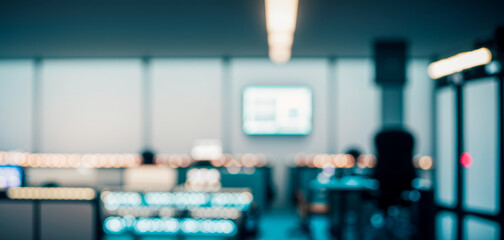 Poster - Blurred office interior with desks computers and people working in a cool tone.futuristic photos with premium quality for poster and banner backgrounds