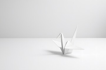 Poster - Elegant White Origami Crane on Minimalist White Surface