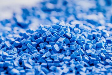 Poster - Close-up of vibrant blue plastic granules in detail Generative AI