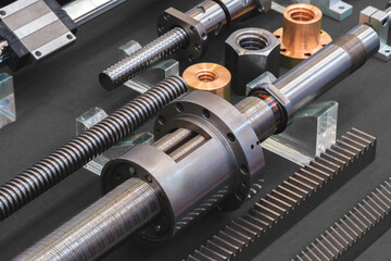 Aufkleber - collection of gears and screws are displayed on a black background. Concept of precision and technicality, as the various parts are arranged in a neat and organized manner