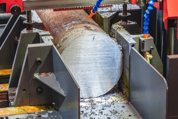 Aufkleber - Industrial band saw cutting large metal part with round cross-section,, industrial concept background