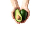 Hands holding fresh avocado on transparent background