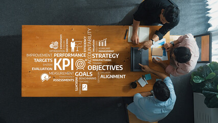 Poster - A group of professionals engaged in a strategic planning session, focusing on performance metrics and KPIs to enhance business objectives and foster effective teamwork in a modern workspace. Amity