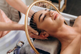 Scalp treatment spa using circulating shower water system for professional head wash therapy.