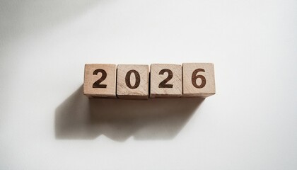 Poster - natural wood block number 2026 on white textured background with long soft shadow in morning light for new year concept, perfect for calendar design, minimalist branding, or modern web graphic

