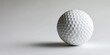 © vefimov - A golf ball ready for a game on a green course.