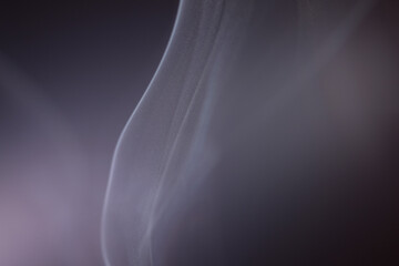 Wall Mural - macro shot of smoke vapour particles release in the air