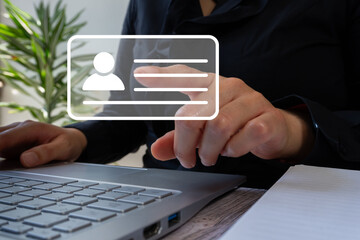 Poster - A person touching an icon of a card with an avatar and text box floating above the laptop keyboard, against an office background.