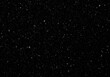 © Vooglo.com - White dots scattered on a dark background resembling falling snow