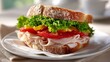 © Velem - Fresh Turkey Sandwich with Lettuce, Tomato, and Cheese on Crusty Bread