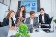 © panomporn - Group of professional business people or accountants working together on financial investment on calculator, doing calculation, analyzing business growth and marketing on graph in modern office.