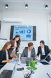 © panomporn - Group of professional business people or accountants working together on financial investment on calculator, doing calculation, analyzing business growth and marketing on graph in modern office.