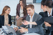 © panomporn - Group of professional business people or accountants working together on financial investment on calculator, doing calculation, analyzing business growth and marketing on graph in modern office.