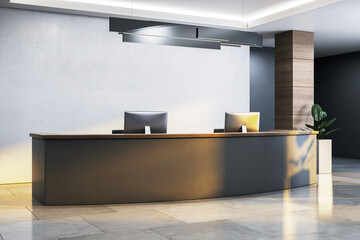 Poster - Modern reception desk with dual monitors in minimalist office interior with sleek lighting and concrete wall background, soft natural light glow. 3D Rendering