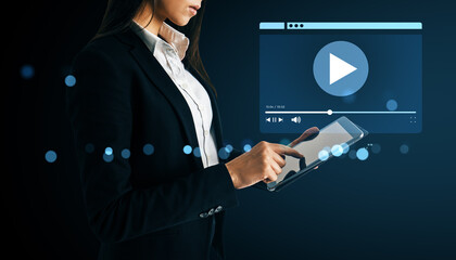 Poster - Businesswoman using tablet to stream video content on digital platform with futuristic background and glowing interface elements.