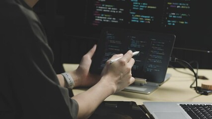 Young adult Asian female software developer coding program on desktop computer. Woman work from home, remote working, freelance programmer job, smart digital nomad lifestyle concept. Close Up