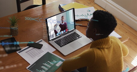 Poster - image of data processing over african american woman having a image call on laptop at home