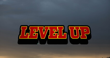 Poster - Image of level up text banner against sunset sky