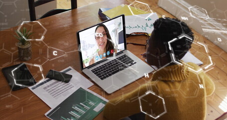 Poster - Image of chemical formulas over african american woman having image call on laptop