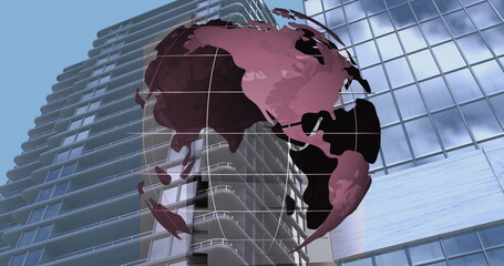 Poster - image of spinning globe against tall buildings in background