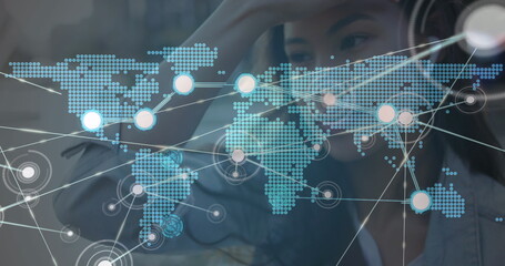 Poster - image of network of connections with world map over woman using smartphone