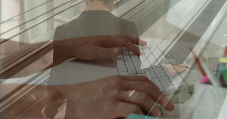 Poster - image of hands using computer over caucasian businessman at airport