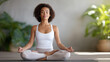 © Kateryna Arkhypova - Meditation Practice in a Serene Yoga Studio with Mixed-Race Woman