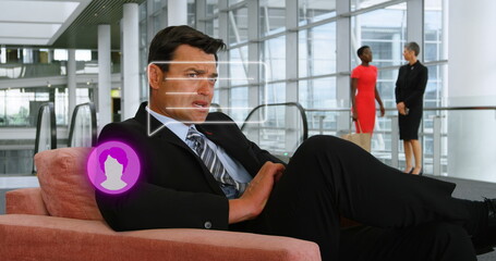 Poster - image of person icon and speech bubble over caucasian businessman using smartphone in foyer