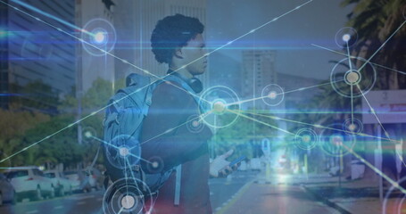 Aufkleber - image of network of connections over african american man with smartphone crossing the street