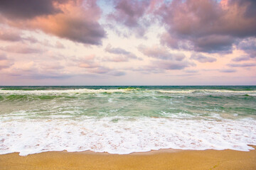 Wall Mural - cloudy evening sky at the black sea. travel inspiration. weather change in nature. beautiful orange 