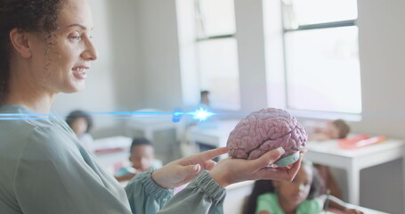 Poster - Image of light trails over diverse schoolchildren and teacher