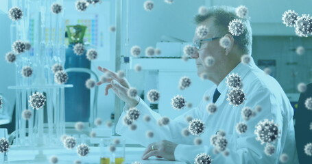 Poster - Image of virus cells over caucasian male doctor in lab