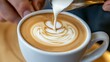 © LELISAT - Specialty coffee craftsmanship and artistic expression in beverages are demonstrated by a skilled barista's ability to create delicate latte art