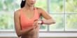 © weedezign - young healthy asian woman use smart watch to measure heart rate after exercise at home