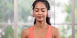 © weedezign - young healthy asian woman listening music while practice yoga at home