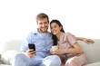 © ty - Young couple watching online content in a smart phone sitting on a sofa at home on a transparent background