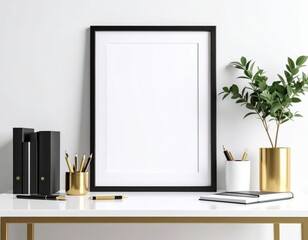 Minimalist workspace with black frame gold accents and green plant on a white desk