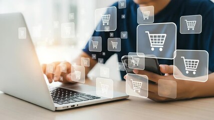 Aufkleber - Man using laptop and smartphone for online shopping surrounded by shopping cart icons overlaying