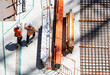 © Austockphoto - Overhead view of a construction site with construction workers having a meeting