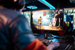 © Marko Geber - Rear view of a man gaming on a PC in a modern esports arena