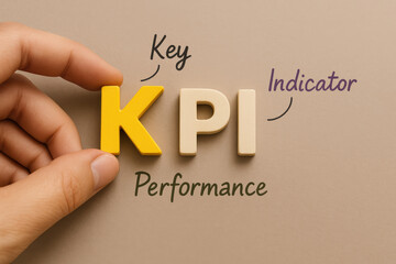 Poster - A close-up a holding a bright yellow letter KPI highlights key performance indicators that drive business success effectively