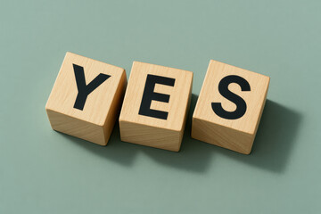 Poster - The concept agreement is conveyed through three wooden cubes arranged to emphasize a positive decision in business contexts