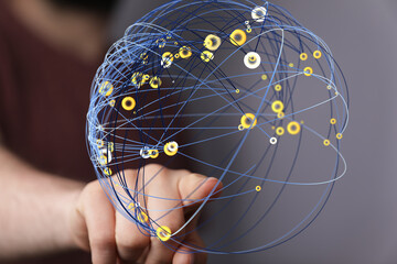 Leinwandbilder - Abstract image of a hand interacting with a digital sphere representing global network connections and data.