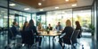 © xartproduction - Blurred Office Meeting - Collaborative Business Team